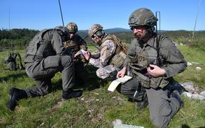 Joint terminal attack controllers from Slovenia, Latvia and Austria prepare to call for fire during an exercise in Slovenia, in 2021. A majority of Americans and western Europeans want a push for a negotiated end to the war in Ukraine, according to a poll released this month by the Institute for Global Affairs.  