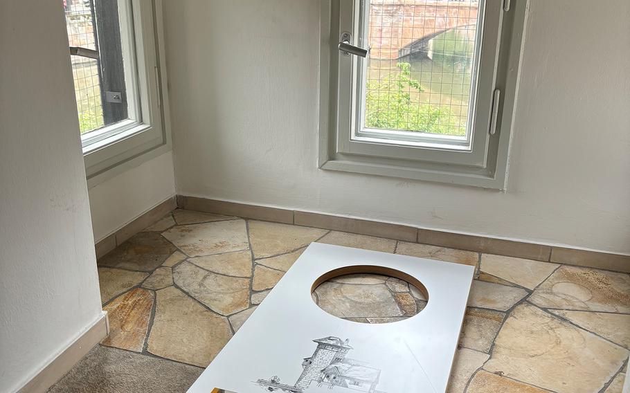 The outline of a hole marks the former location of the executioner's toilet above the Pegnitz River in the Henkerhaus in Nuremberg, Germany.