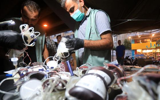 Medics collect blood donations in Beirut's southern suburb on Sept.17, 2024, after explosions hit locations in several Hezbollah strongholds around Lebanon amid ongoing cross-border tensions between Israel and Hezbollah fighters. Hundreds of pagers used by Hezbollah members exploded across Lebanon Tuesday, killing at least eight people and wounding Tehran's ambassador in Beirut in blasts the Iran-backed militant group blamed on Israel. (AFP/Getty Images/TNS)