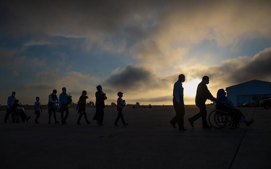 Evacuees from Afghanistan depart a U.S. Air Force KC-10 Extender after landing at Naval Station Rota, Spain, Aug. 31, 2021.