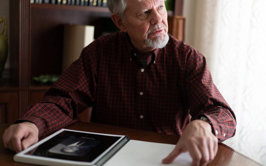 Charles Simpson, 77, at his home in Silver Spring, Md., looks through a scrapbook about his uncle, Technical Sgt. James L. Simpson, who was killed in France on May 22, 1945.