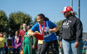 Daisy Elliott competes in the disc throw during the Kanto Plains Special Olympics at Yokota Air Base, Japan, Nov. 9, 2024.