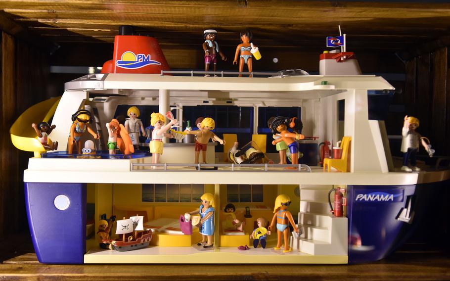 A Playmobil cruise ship with bathing-suit-clad figures is among various types of toy water vessels featured in the “We Love Playmobil” exhibition at the Historical Museum of the Pfalz in Speyer, Germany, celebrating the 50th anniversary of the German toy.