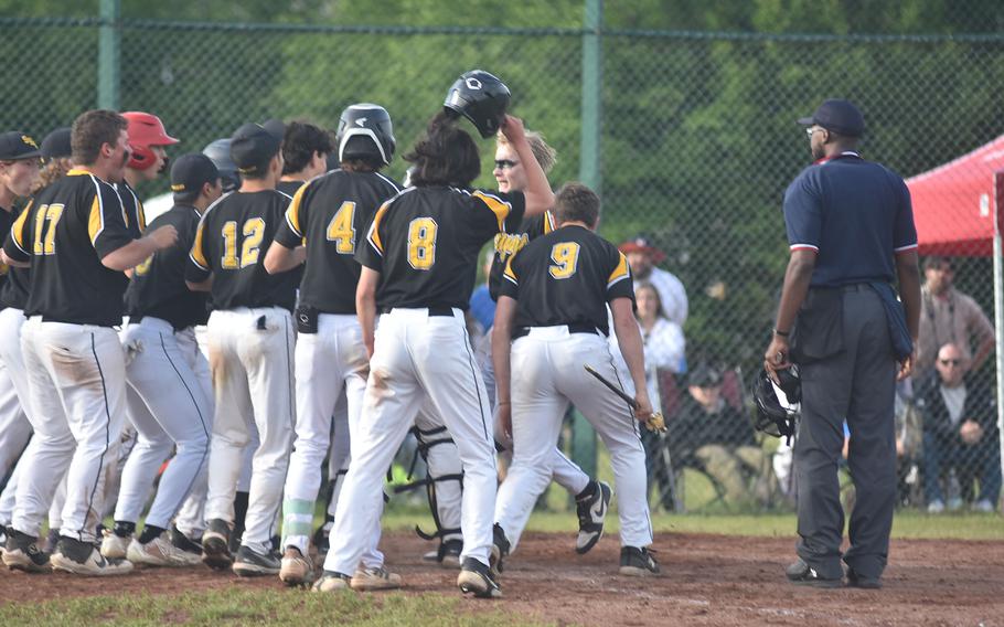The Stuttgart Panthers get set to mob Jackson Boggs after he tied DODEA European Division I championship game with a three-run homer in the sixth inning. Ramstein went on to win the game Friday, May 24, 2024, in eight innings.