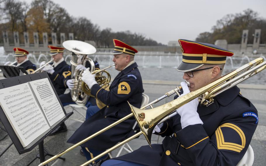 Army musicians playing instruments during the ceremony.