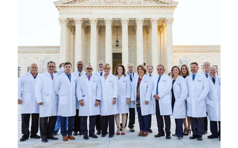 Medical personnel with America’s Frontline Doctors are seen in a May 30, 2023, post standing in front of the Supreme Court in Washington, D.C.