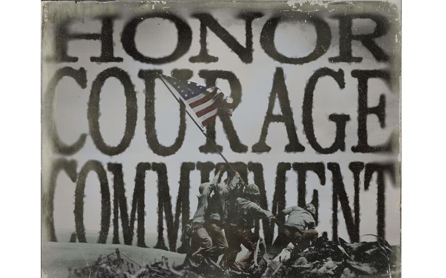 A black-and-white image of Marines raising a U.S. flag with the words “Honor, Courage, Commitment” in large letters behind it.