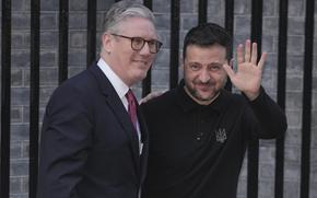 Britain's Prime Minister Keir Starmer, left, greets Ukraine's President Volodymyr Zelenskyy in Downing Street, London, England, Saturday, March 1, 2025. (AP Photo/Kin Cheung)