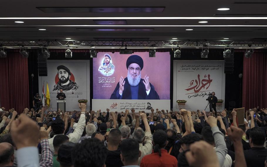 Supporters of the Iranian-backed Hezbollah group listen to a speech by Hezbollah leader Sayyed Hassan Nasrallah speaking via a video link, in the southern suburbs of Beirut, Lebanon, Tuesday, May 14, 2024. Israel and the Lebanese militant group Hezbollah have recently ratcheted up their threats of an all-out war. Hezbollah leader Hassan Nasrallah warned Israel last week that if it launches an offensive in Lebanon, his group has new weapons and capabilities it can use against Israeli forces and cities, unlike during their previous wars. 