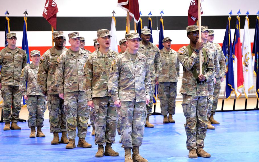 Soldiers sing the Army Song at the conclusion of the Medical Readiness Command, Europe’s change of command ceremony in Sembach, Germany, Oct. 26, 2023.