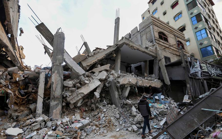 People inspect damage and recover items from their homes following Israeli airstrikes on March 4, 2024 in Rafah, Gaza. Israel’s military is pressing ahead with its operations against Hamas in Rafah despite a ruling from the International Court of Justice ordering it to halt such activity in the name of sparing civilians.