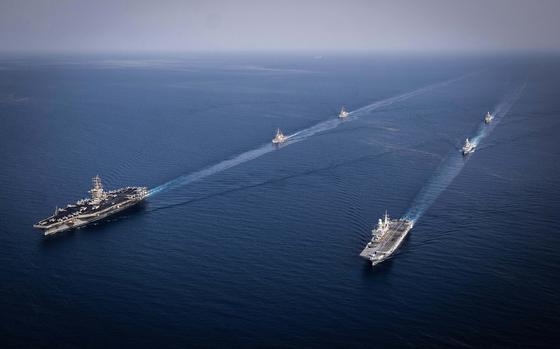 Components of the Dwight D. Eisenhower Carrier Group (IKECSG), Nimitz-class aircraft carrier USS Dwight D. Eisenhower (CVN 69) and Arleigh Burke-class guided-missile destroyers USS Laboon (DDG 58) and USS Gravely (DDG 107), steam in formation with the Italian aircraft carrier ITS Cavour (CVH 550), the Carlo Bergamini-class frigate ITS Alpino (F 594), and the Horizon-class frigate FS Forbin (D 620) in the Red Sea, June 7. The IKECSG is deployed to the U.S. 5th Fleet area of operations to support maritime stability and security in the Middle East region. (Official Italian Navy photo)