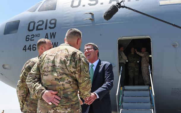 Bagram Air Field, Afghanistan, Jul. 12, 2016: Defense Secretary Ash Carter is greeted by U.S. Air Force officers at Bagram Air Field. The secretary traveled to Kabul to meet with Afghan leadership and Resolute Support commanders.

META TAGS: Operation Enduring Freedom, War on Terror, Afghanistan, Afghan, DEFSEC