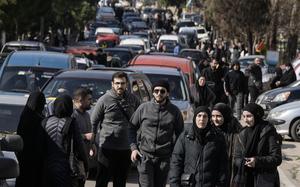 Lebanese citizens gathering as prepare to return to their homes while Israeli soldiers block a road leads to the southern Lebanese village of Aitaroun, Lebanon, Monday, Jan. 27, 2025. (AP Photo/Bilal Hussein)