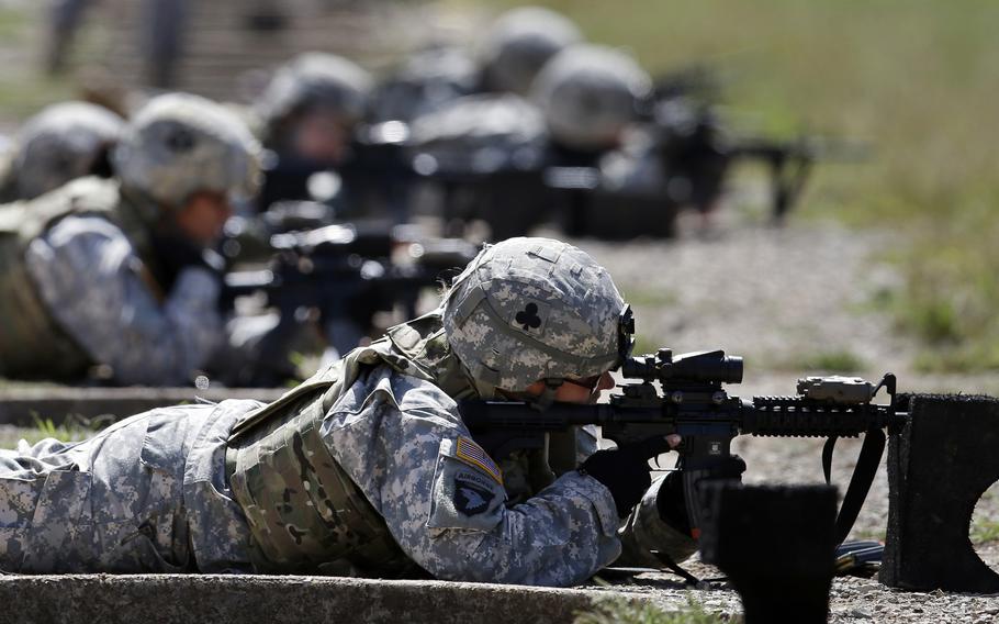 Female soldiers from 1st Brigade Combat Team, 101st Airborne Division train on a firing range.