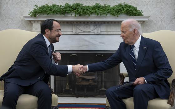 FILE - US President Joe Biden shakes hands during a meeting with President of Cyprus Nikos Christodoulides, left, in the Oval Office of the White House in Washington, Wednesday, Oct. 30, 2024. (AP Photo/Ben Curtis, File)