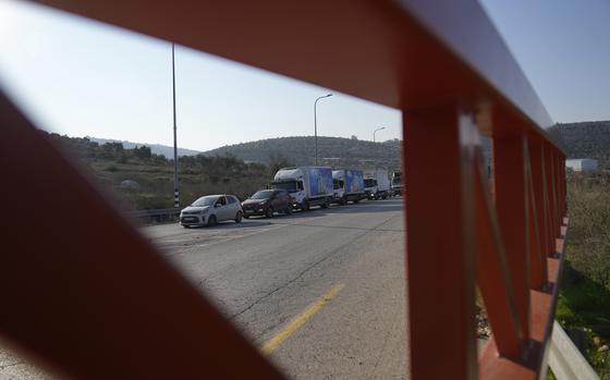 Palestinian motorists waiting in line at the Ein Senia Israeli army checkpoint.