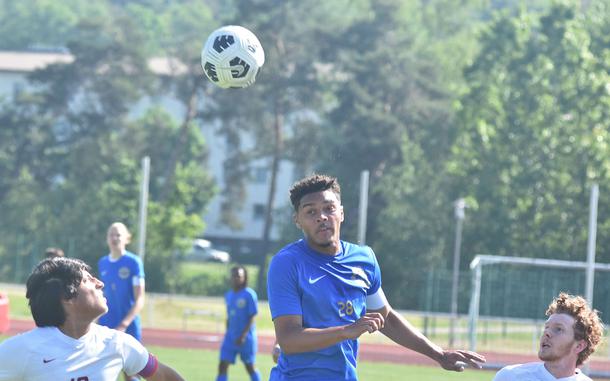 Ramstein's Max Speed heads the ball against Lakenheath in the Royals 2-0 victory on the first day of the DODEA European Division I boys soccer championships Monday, May 20, 2024, at Kaiserslautern High School.
