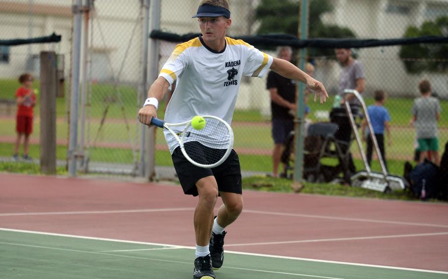 Kadena's Micah Berry hits a backhand during Tuesday's Okinawa tennis singles matches. Berry beat Kubasaki's Jacy Fisk 6-2.