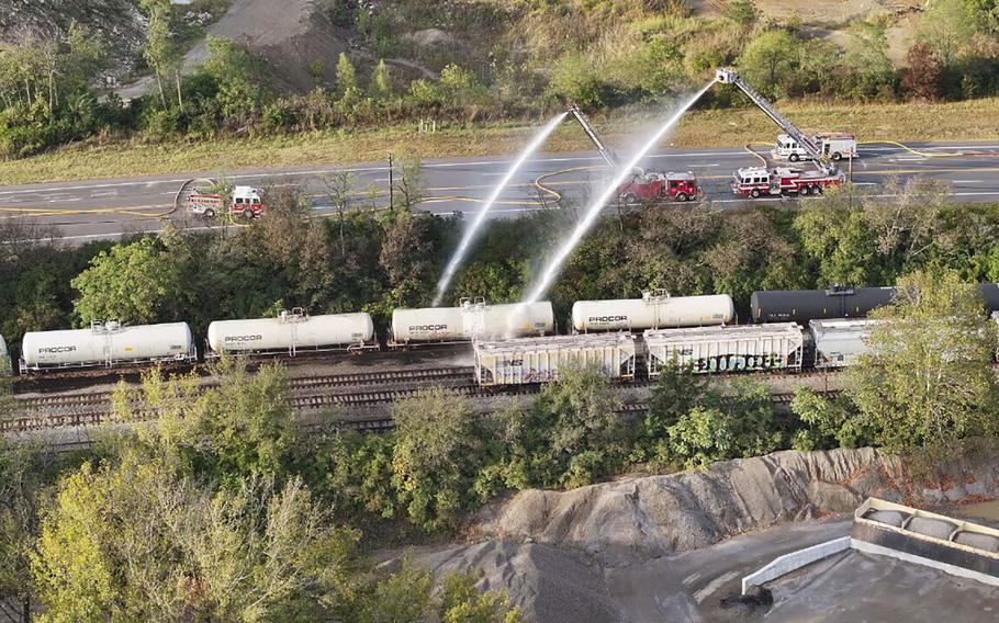 Firefighters work on the scene of a chemical leak in rail cars in Ohio