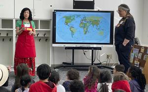 Fourth-grade teachers Rosemarie Martin, left, and Delia Cruz speak about Hispanic cultures and traditionas at John O. Arnn Elementary School near Camp Zama, Japan, on Feb. 15, 2024. 