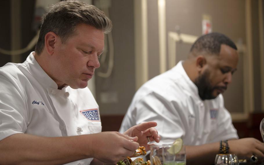 Chef Tyler Florence, from left, and Chef Matt Horn, from Oakland, Calif., taste and judge tacos