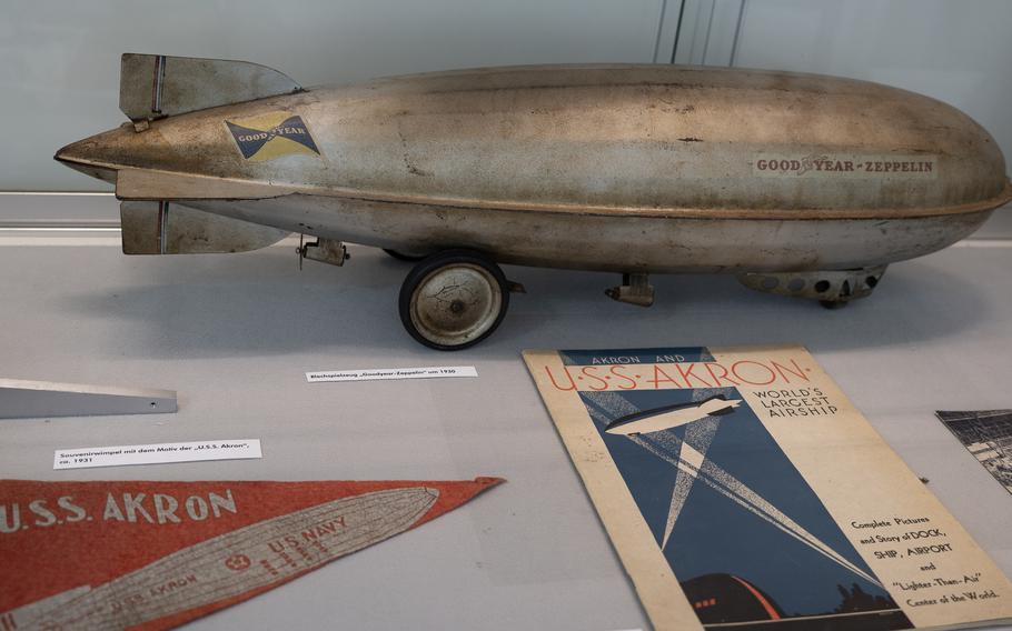 A metal re-creation of a Goodyear-Zeppelin airship is exhibited along with USS Akron memorabilia on Sept. 1, 2024, at the Zeppelin Museum in Neu-Isenberg, Germany. The Akron, which operated between 1931 and 1933, shares the world record with its sister aircraft, the USS Macon, as the largest helium-filled airship in history.