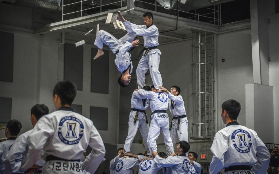 A taekwondo practitioner performs aerial kicks during a taekwondo exhibition in Carey Fitness Center at Camp Casey, South Korea, on June 28, 2024.