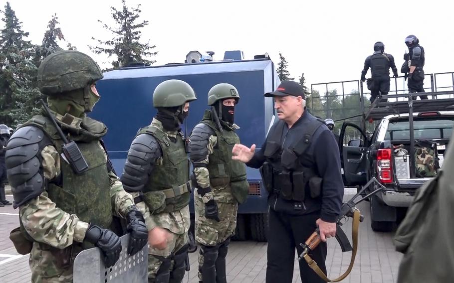 President Alexander Lukashenko greets riot police near the Palace of Independence in Minsk, Belarus, amid street protests on Aug. 23, 2020.