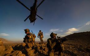 U.S. Air Force pararescuemen from the 83rd Expeditionary Rescue Squadron secure the landing area after being lowered from a HH-60 Pave Hawk during a November 2012 mission in Afghanistan.