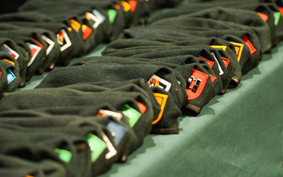 Berets displayed on a table.