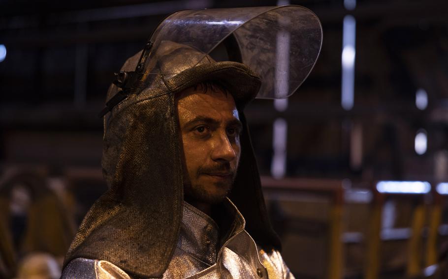 Oleksii Klashnik, 29, wears a fireproof suit at the furnace of the Zaporizhstal steel plant on May 29.