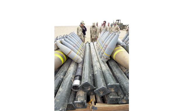 HED: Getting ready for boom, 2004

Fallujah, Iraq, Jan. 17, 2004: Members of the U.S. Army's Captured Enemy Ammunition Operations and contractors from EOD Technology Inc., based in Knoxville, Tenn. look over a pile of Iraqi artillery shells, bombs and missiles being set up for demolition.

The Army hired four civilian contractors to collect, store and begin destroying about 600,000 tons of Iraqi ammunitions. The contract worth $300 million reduces enemy stockpiles and alleviates soldiers from hazardous demolition duty. 

META TAGS: Operation Iraqi Freedom; Captured Enemy Ammunition Operations; Task Force Bullet; 