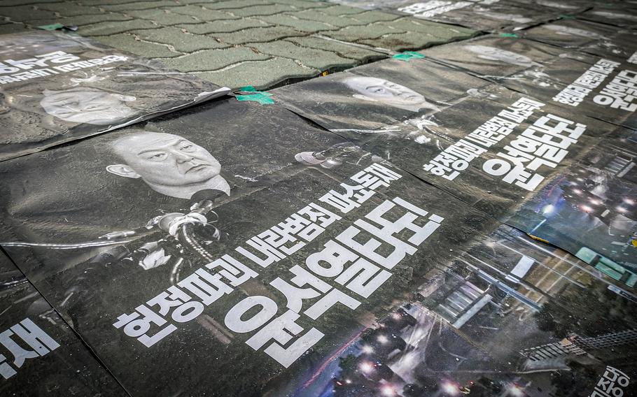 Banners in Seoul call for the ouster of South Korean President Yoon Suk Yeo.