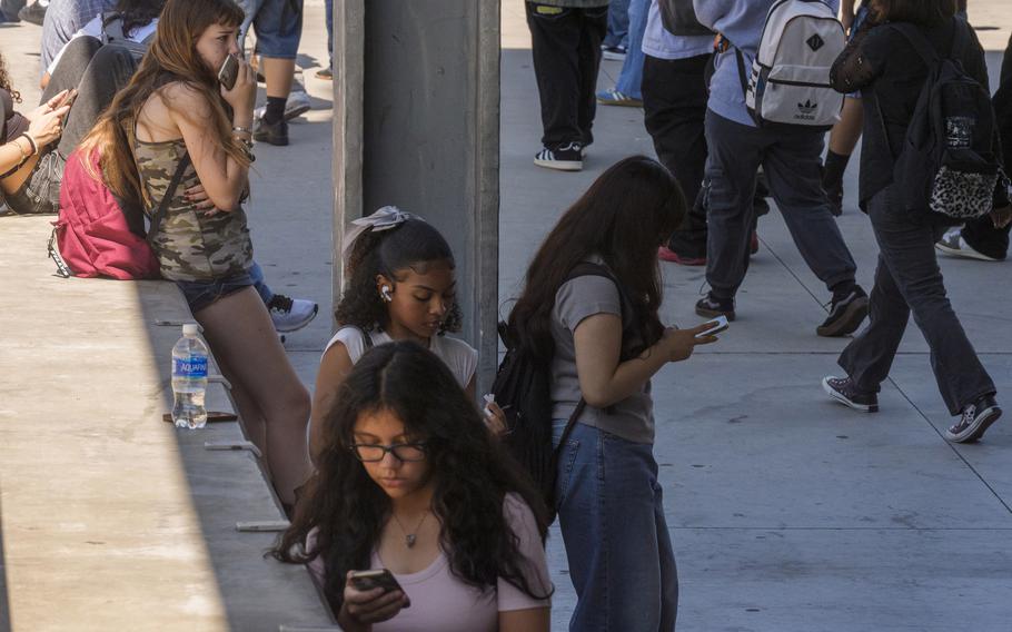 High school students in Los Angeles using their cellphones