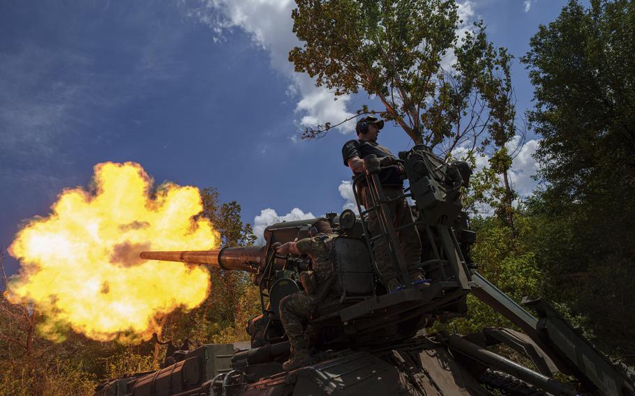 Ukrainian soldiers, of 43rd artillery brigade, fire by 2s7 self-propelled howitzer towards Russian positions at the frontline in Donetsk region, Ukraine, Monday, June 24, 2024. 