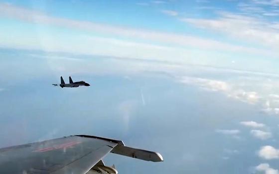 Chinese fighters fly in the blue sky in a video screenshot.