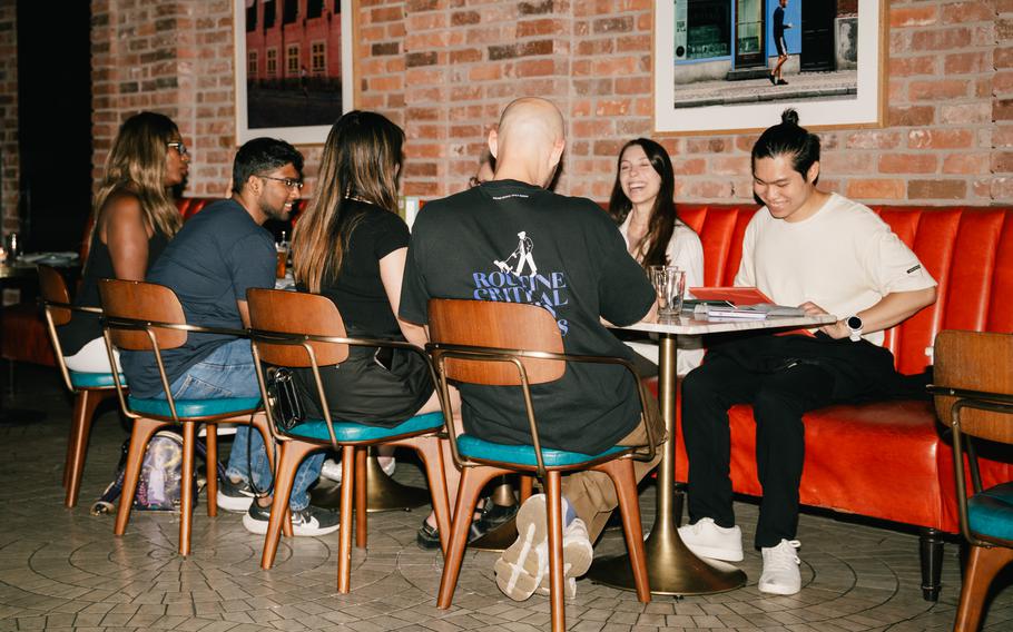 Timeleft members gather for dinner at Sungold in Arlo Williamsburg in New York City on Aug. 14. New York City is Timeleft’s busiest U.S. market. The service arranges Wednesday night dinners for six-person groups in 170 cities across 37 countries.