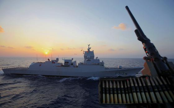 FILE - The Norwegian warship "Helge Ingstad" passes by the Danish warship Esbern Snare during an escort of the cargo ships with Syrias chemical weapons at Mediterranean sea between Cyprus and Syria, Sunday, Jan. 5, 2014. (AP Photo/Petros Karadjias, File)