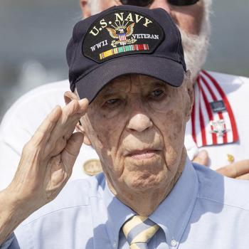 World War II Navy veteran Callan Saffell salutes during the 20th anniversary celebration of the National World War II Memorial in Washington, May 25, 2024.