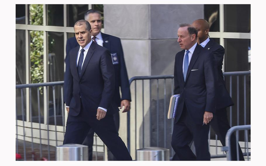 Hunter Biden, left, and his attorney, Abbe David Lowell, right center, depart federal court at the J. Caleb Boggs Federal Building in Wilmington, Delaware on Oct. 3, 2023.