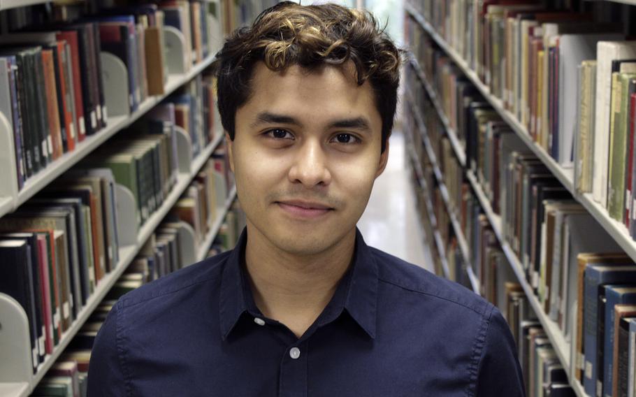 Brian Montes, a 21-year-old political science major at Portland State University and the first in his family to vote, poses for a photo in the university library in Portland, Ore., Nov. 3, 2022. 