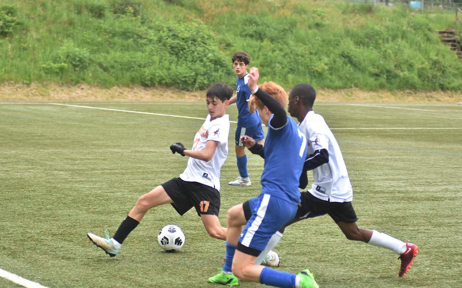 Brussels' Cade Wedekind kicks the ball through the legs of Spangdahlem's James Idems in the Sentinels' 2-1 victory Tuesday, May 21, 2024, that clinched the team a spot in Wednesday's semifinals at the DODEA European Division III boys soccer championships at Landstuhl, Germany.