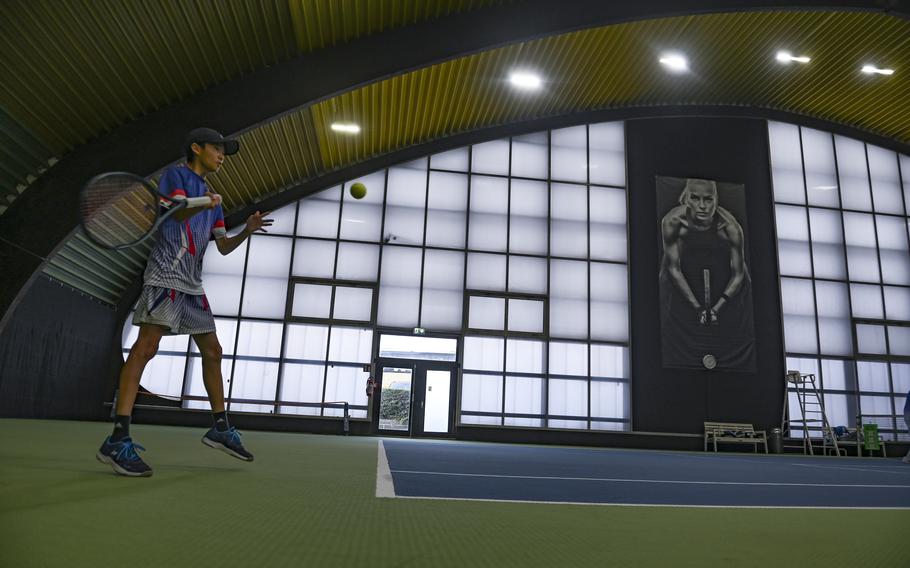 Ramstein’s Sean Kim strikes the ball at the corner back to Naples’ Kai Barania and Tavi Shah at the DODEA European tennis championships at T2 Sports Health Club in Wiesbaden, Germany, on Oct. 21, 2023.