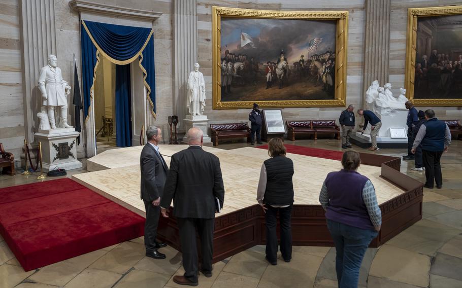 Officials inspect the construction of a stand in the Rotunda, where President-elect Donald Trump is due to take the oath of office on Monday, at the Capitol in Washington, Friday, Jan. 17, 2025. 