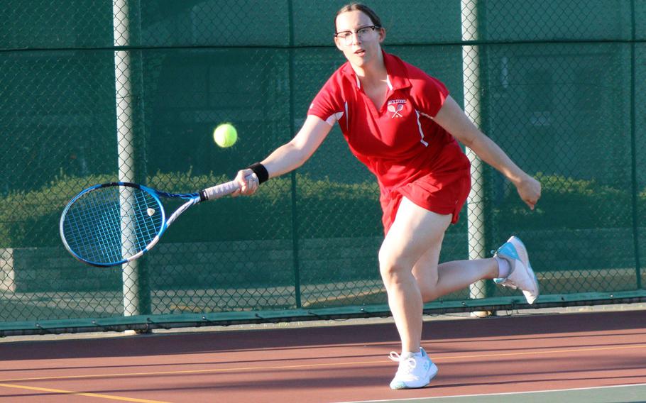 Nile C. Kinnick's Ausumn Hendra runs down a shot during Tuesday's Kanto Plain tennis matches. American School In Japan's Chaness Kim beat Hendra 8-0.