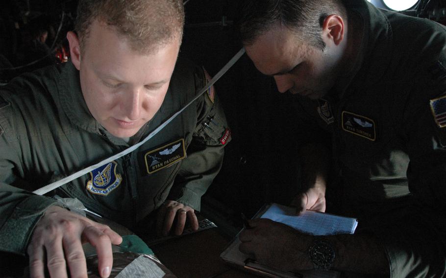 1st Lt. Ryan Paschal and Capt. Ryan Turonek, both study map details