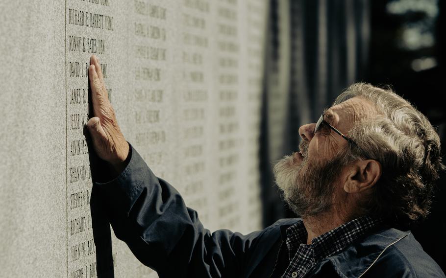 A family member of a fallen service member pays his respects following the 40th Beirut Memorial Observance Ceremony at Lejeune Memorial Gardens in Jacksonville, North Carolina, Oct. 23, 2023. The memorial observance is held annually on October 23 to remember the lives lost in the terrorist attacks at the U.S. Marine Barracks in Beirut, Lebanon and Grenada.