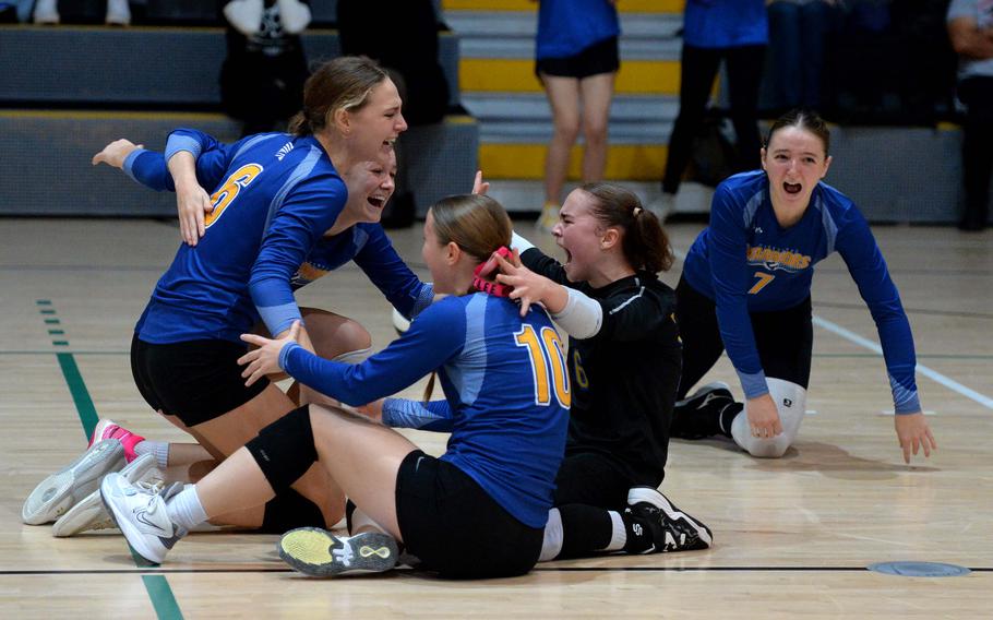 The Wiesbaden Warriors celebrate their Division I title after defeating the Ramstein Royals 25-18, 12-25, 25-16, 22-25,15-13 at the DODEA-Europe volleyball finals in Ramstein, Germany, Oct. 28, 2023.