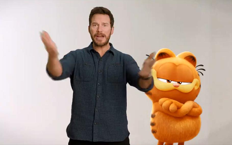 Actor Chris Pratt and the other star of "The Garfield Movie" are seen in this screenshot from a promotional video posted to social media. Pratt took time out for an online talk with service members and their families on May 23, 2024. The 30-minute video call was hosted by the USO.